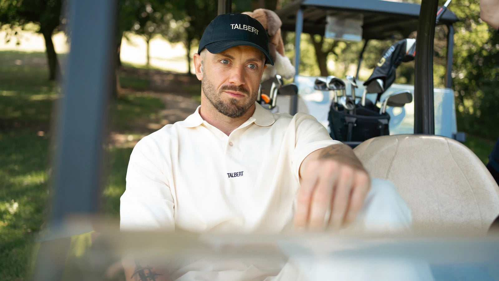 Model wearing Talbert Golf 001 Polo in cream on golf course